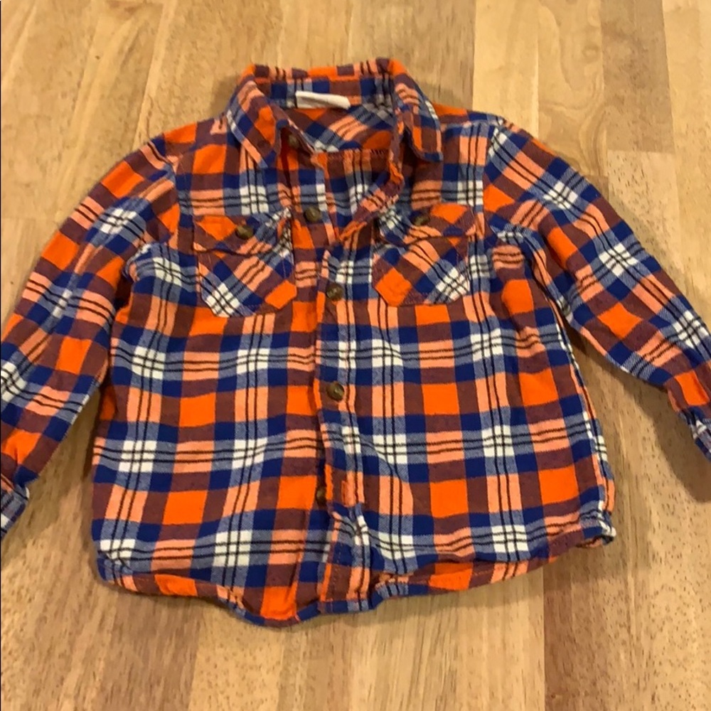 4/10$$ Plaid flannel button down shirt.